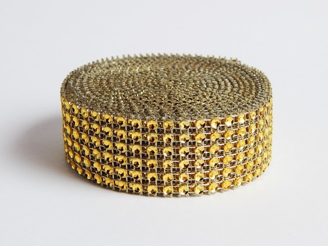 Obrázek k výrobku 16811 - Diamantový pás plastový zlatý (3 cm x 4,57 m)